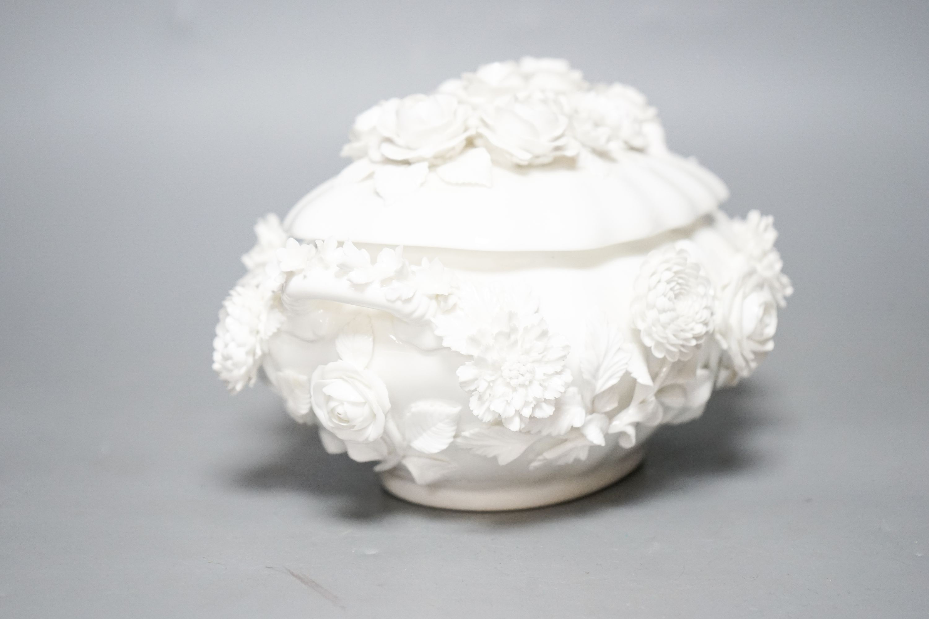 A Coalbrookdale by Coalport white glazed porcelain floral encrusted bowl and cover 23cm